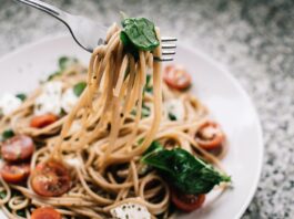 selective focus photography of pasta with tomato and basil 1279330 scaled