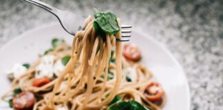 selective focus photography of pasta with tomato and basil 1279330 scaled