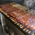 arrosticini durante la cottura